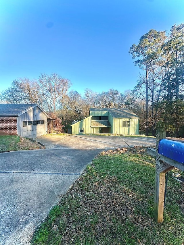 view of property exterior with an outbuilding and a garage