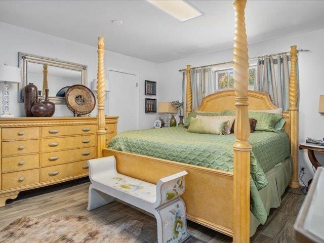 bedroom with hardwood / wood-style floors