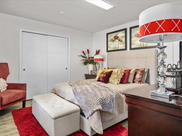 bedroom with a closet and wood-type flooring