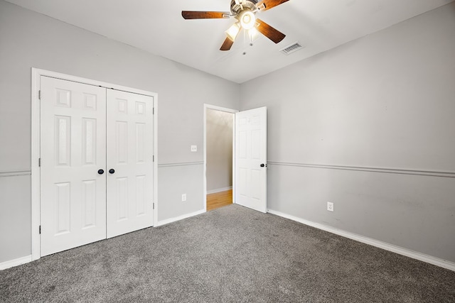 unfurnished bedroom featuring carpet, a closet, and ceiling fan