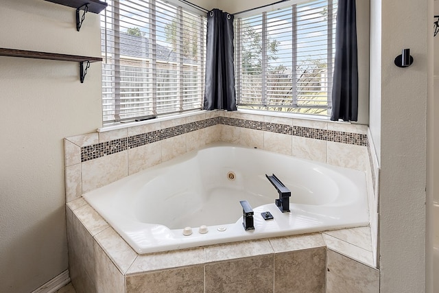 bathroom featuring a relaxing tiled tub