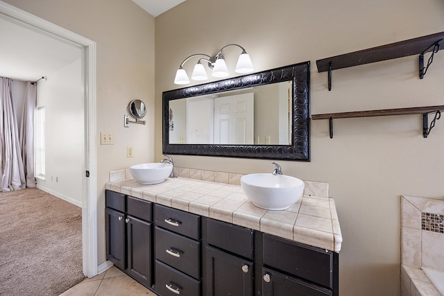 bathroom featuring tile patterned flooring and vanity