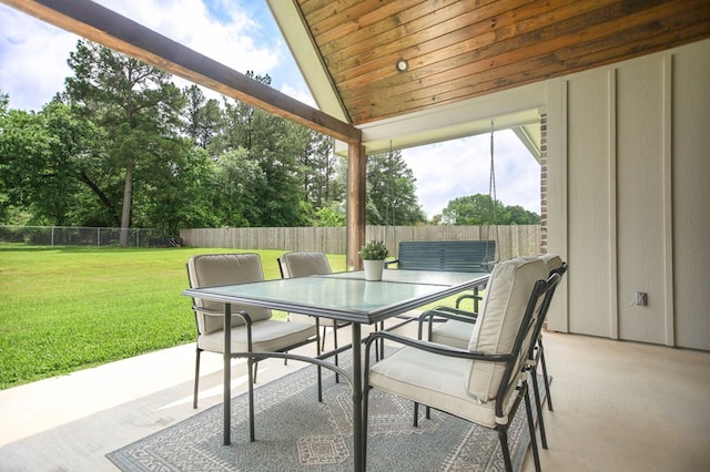 view of patio with a fenced backyard and outdoor dining space
