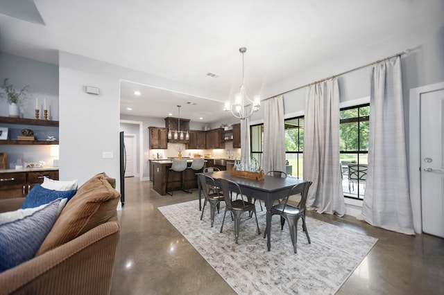 dining space featuring recessed lighting, concrete floors, a chandelier, and visible vents