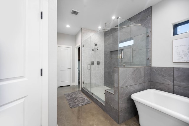 full bathroom with a soaking tub, a shower stall, recessed lighting, and visible vents