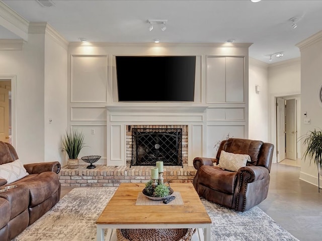 living room featuring light wood-type flooring, crown molding, and a brick fireplace