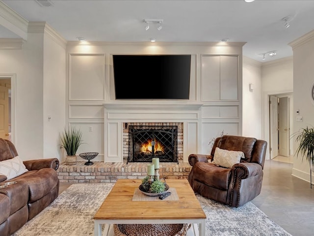 living room featuring light wood-type flooring, crown molding, and a brick fireplace