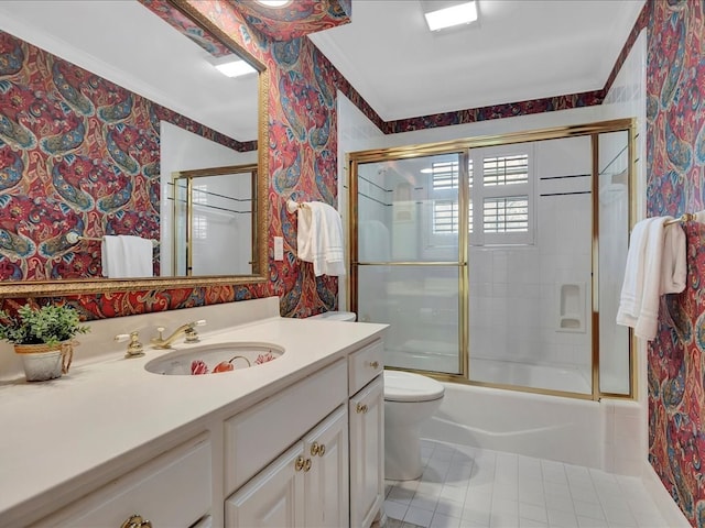 full bathroom with tile patterned floors, crown molding, toilet, shower / bath combination with glass door, and vanity