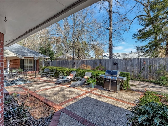 view of patio featuring a grill