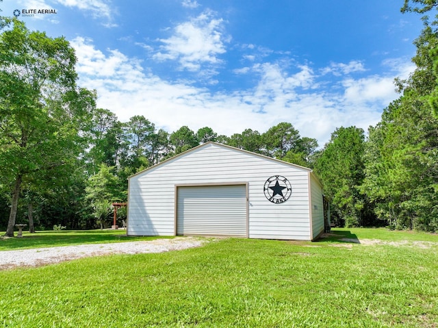 garage featuring a yard