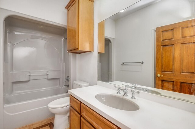 full bathroom featuring vanity, toilet, and bathtub / shower combination