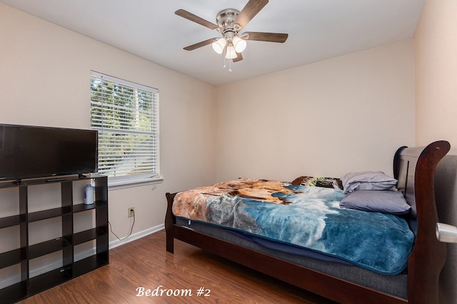 bedroom with ceiling fan and dark wood-type flooring