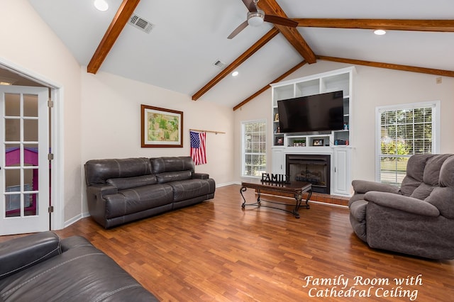 living room featuring beamed ceiling, hardwood / wood-style flooring, high vaulted ceiling, and ceiling fan