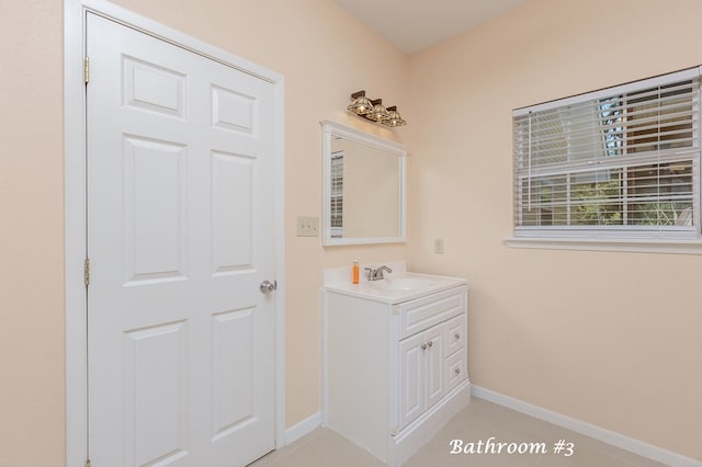 bathroom with tile patterned flooring and vanity