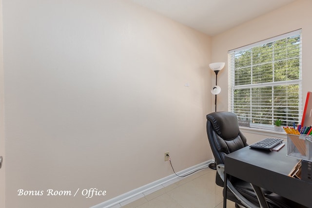 home office featuring light tile patterned floors