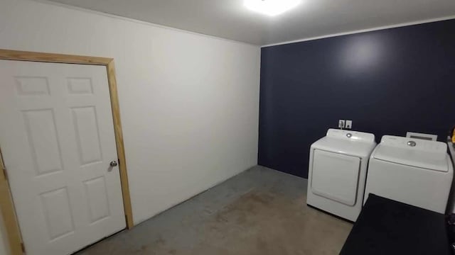 laundry area with washing machine and clothes dryer