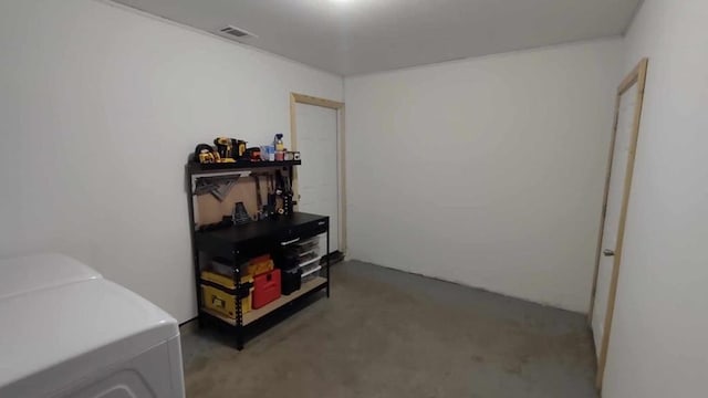 miscellaneous room featuring washing machine and clothes dryer and carpet floors