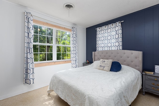 bedroom featuring carpet flooring and crown molding