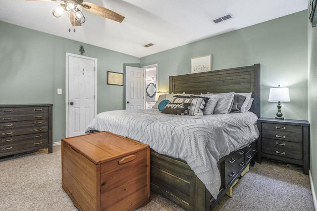 bedroom featuring ceiling fan and light colored carpet