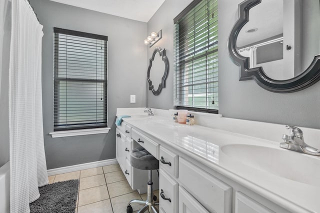 bathroom with tile patterned flooring and vanity