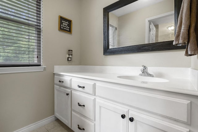 bathroom with tile patterned flooring and vanity