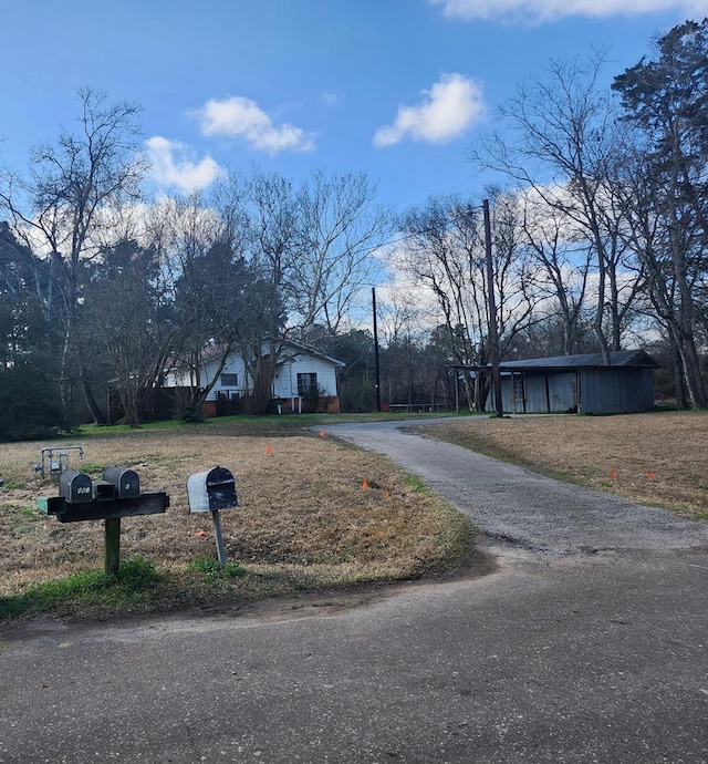 view of road with driveway