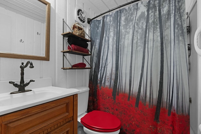 bathroom with vanity, a shower with shower curtain, and toilet