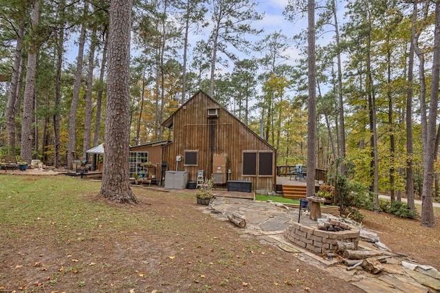 rear view of house with a wooden deck