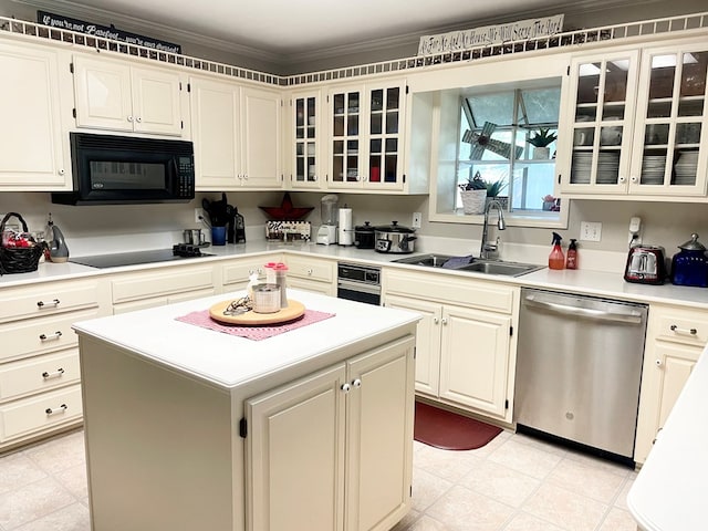 kitchen with sink, a center island, ornamental molding, and black appliances