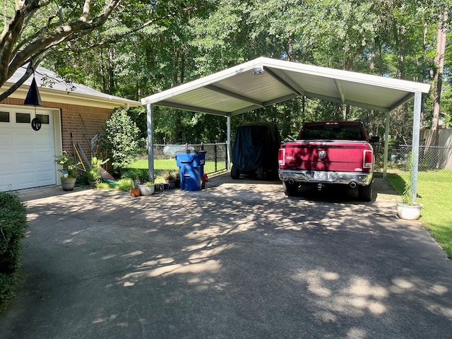 view of parking / parking lot with a garage and a carport