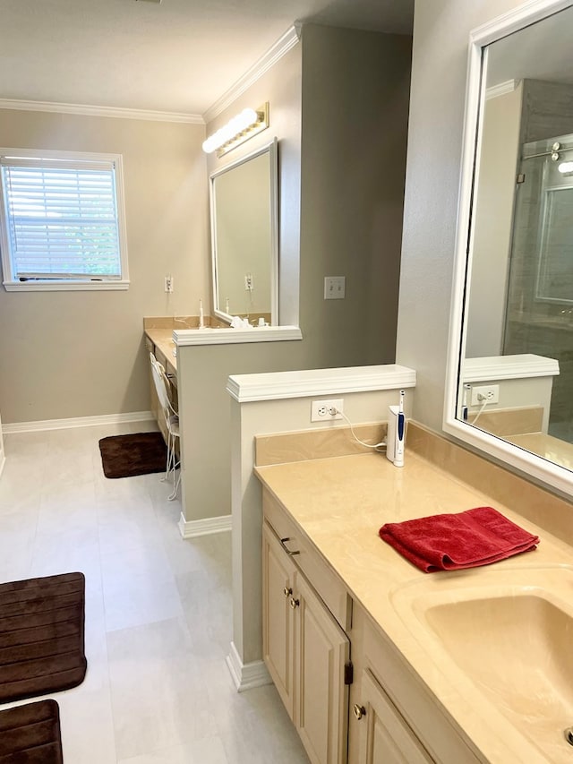 bathroom with tile patterned floors, vanity, a shower with shower door, and crown molding