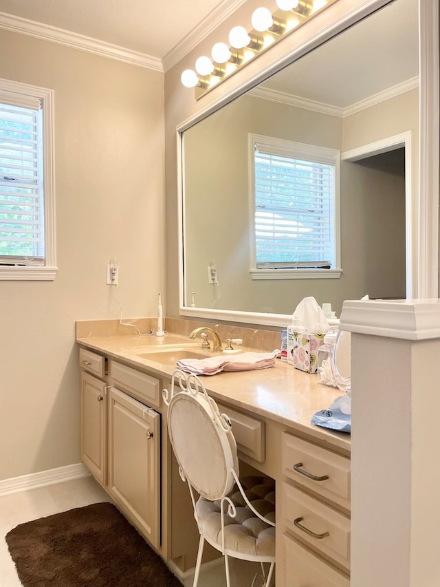 bathroom with a wealth of natural light, vanity, and ornamental molding