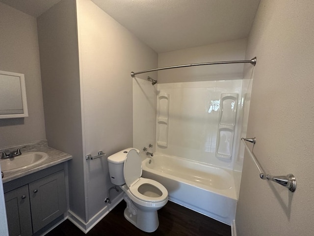 full bathroom featuring vanity, hardwood / wood-style flooring, shower / tub combination, and toilet