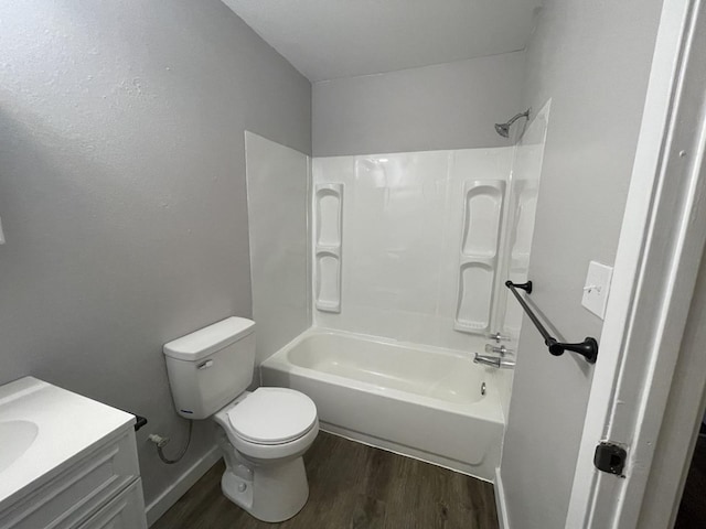 full bathroom with vanity, wood-type flooring, shower / tub combination, and toilet