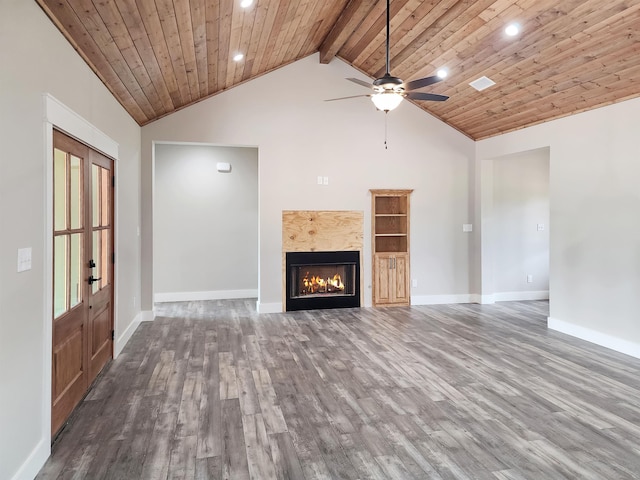 unfurnished living room with dark hardwood / wood-style flooring, beamed ceiling, wood ceiling, and high vaulted ceiling