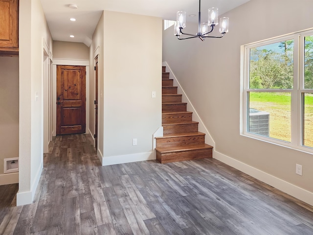 interior space featuring a notable chandelier and wood-type flooring