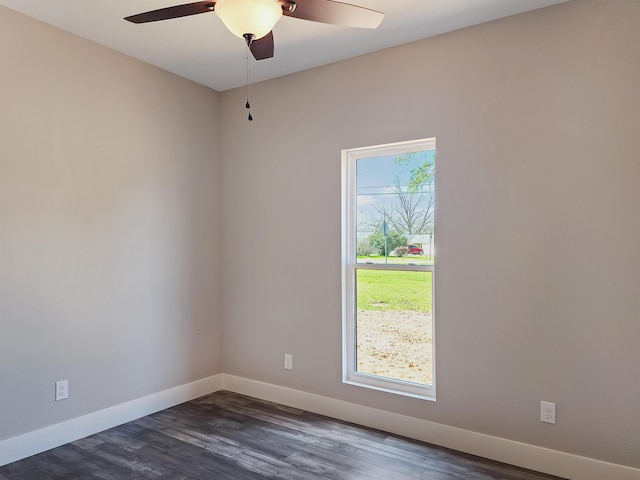 unfurnished room featuring dark hardwood / wood-style floors and ceiling fan