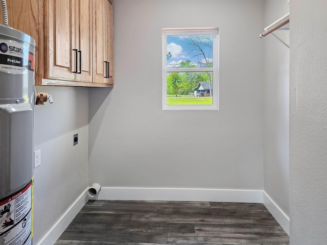 clothes washing area with cabinets, strapped water heater, dark wood-type flooring, and electric dryer hookup