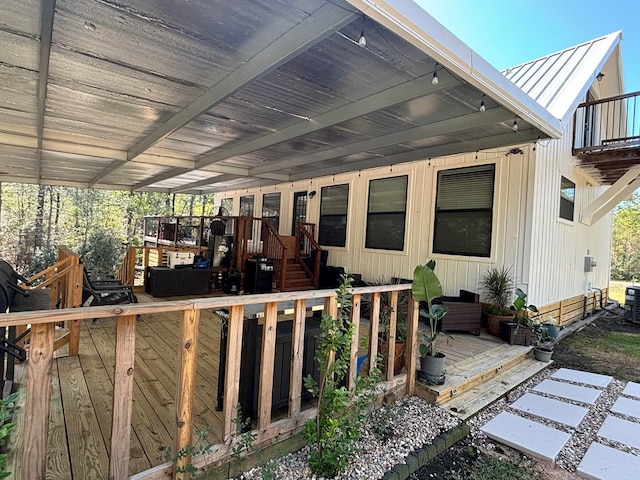 exterior space with central AC and a wooden deck