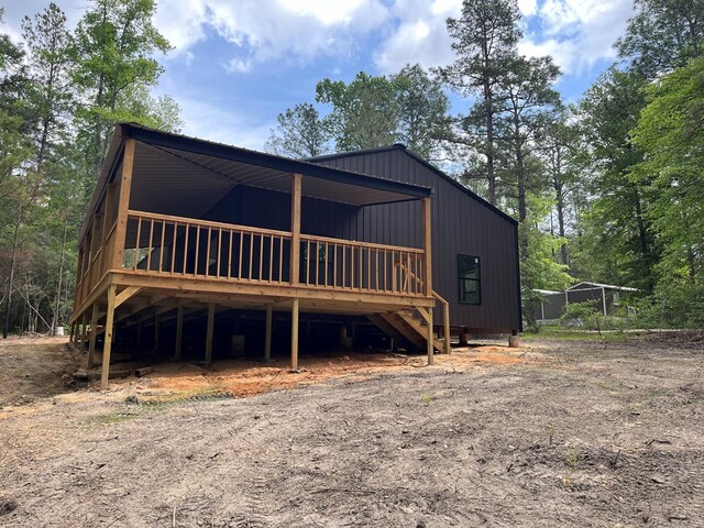 view of front of property featuring a wooden deck