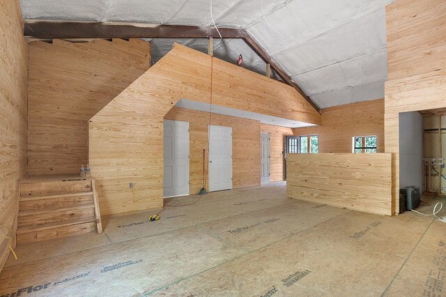 415 Sloe Ln, Brookeland, TX 75931 - interior space with wooden walls and high vaulted ceiling