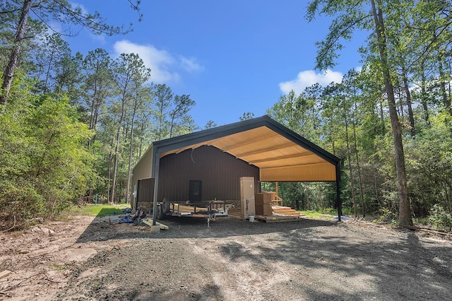 415 Sloe Ln, Brookeland, TX 75931 - view of parking / parking lot featuring driveway and a carport
