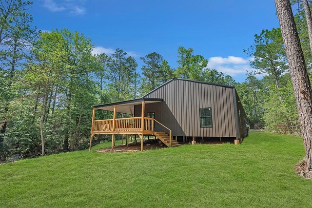 415 Sloe Ln, Brookeland, TX 75931 - rear view of property with a wooden deck, a lawn, and stairway
