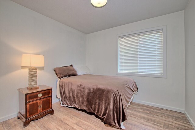 bedroom featuring light wood-type flooring