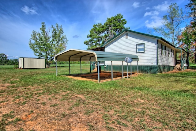 view of yard with a carport and a storage unit