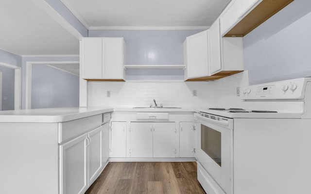 210 Forest Park Blvd, Lufkin, TX 75904 - kitchen featuring electric range, open shelves, a peninsula, decorative backsplash, and white cabinetry
