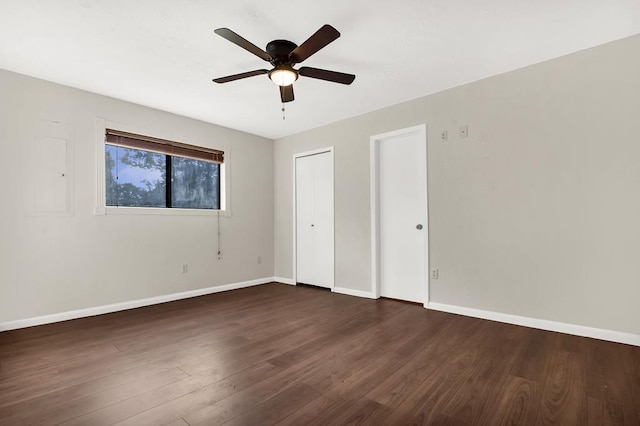 unfurnished bedroom with dark hardwood / wood-style flooring and ceiling fan