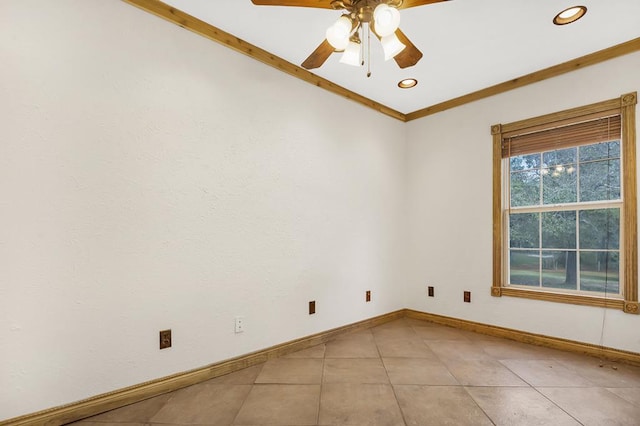 tiled empty room featuring crown molding and ceiling fan