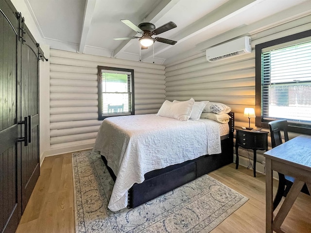 bedroom featuring beam ceiling, rustic walls, light hardwood / wood-style flooring, and multiple windows