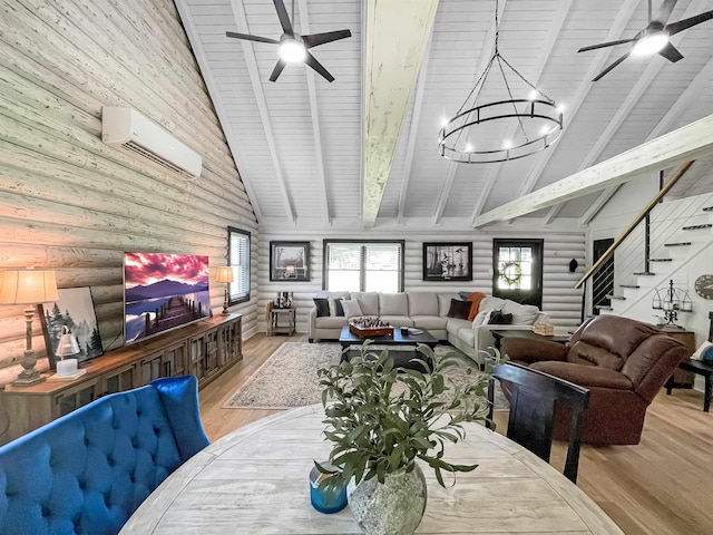 dining space with ceiling fan with notable chandelier, light hardwood / wood-style flooring, high vaulted ceiling, and a wall mounted air conditioner